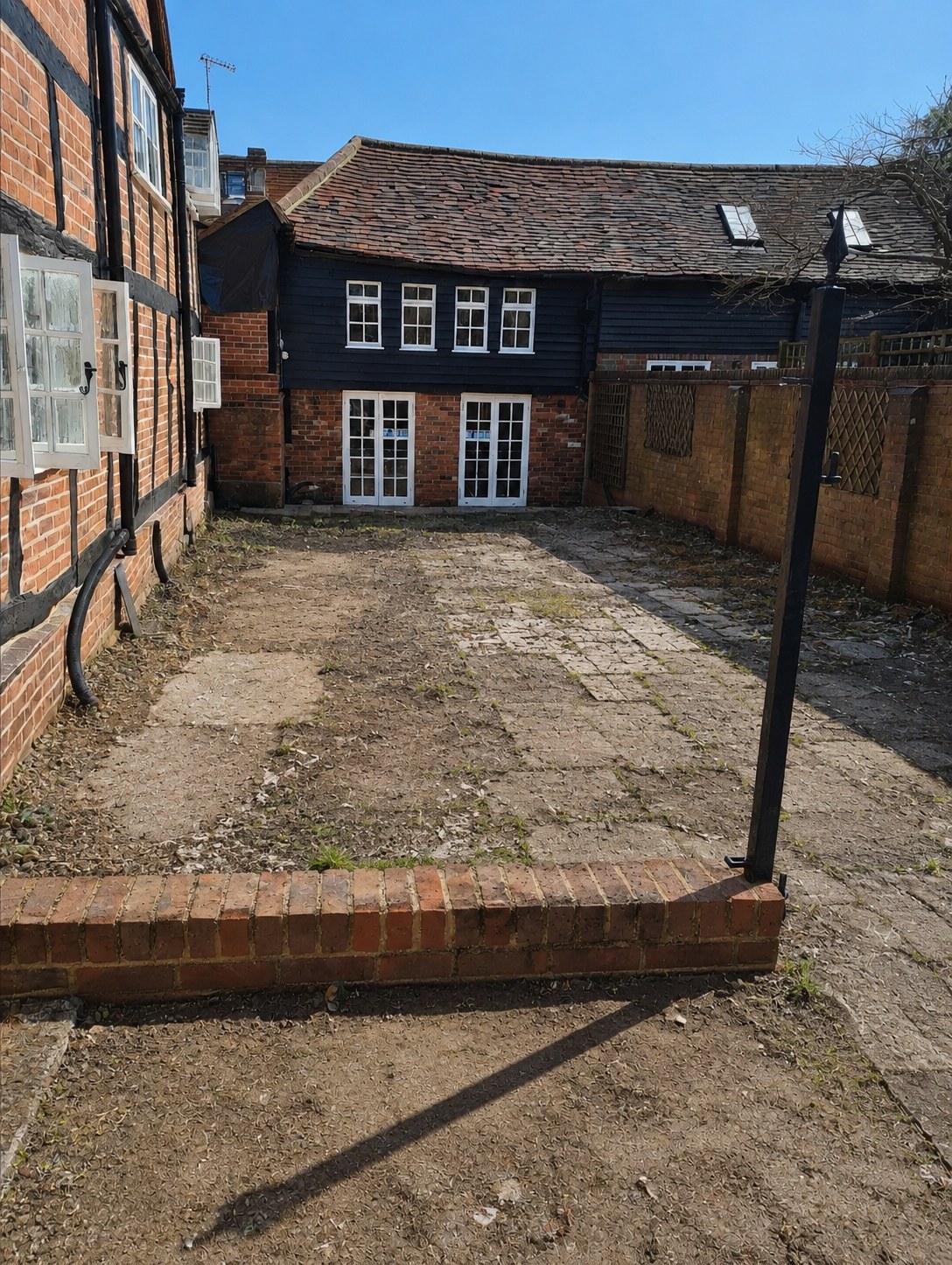Before courtyard patio transformation