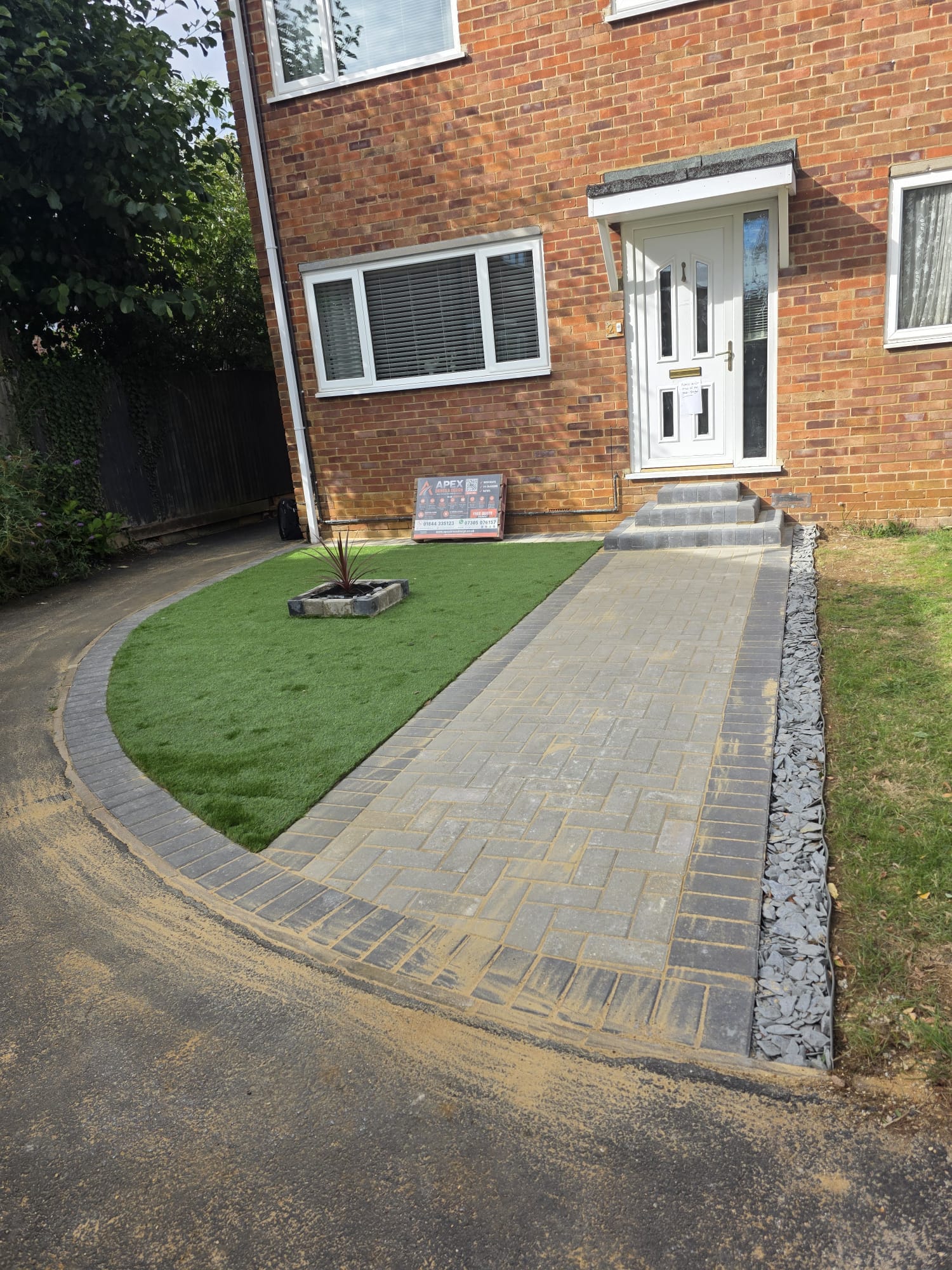 Completed block-paved path with new entrance steps